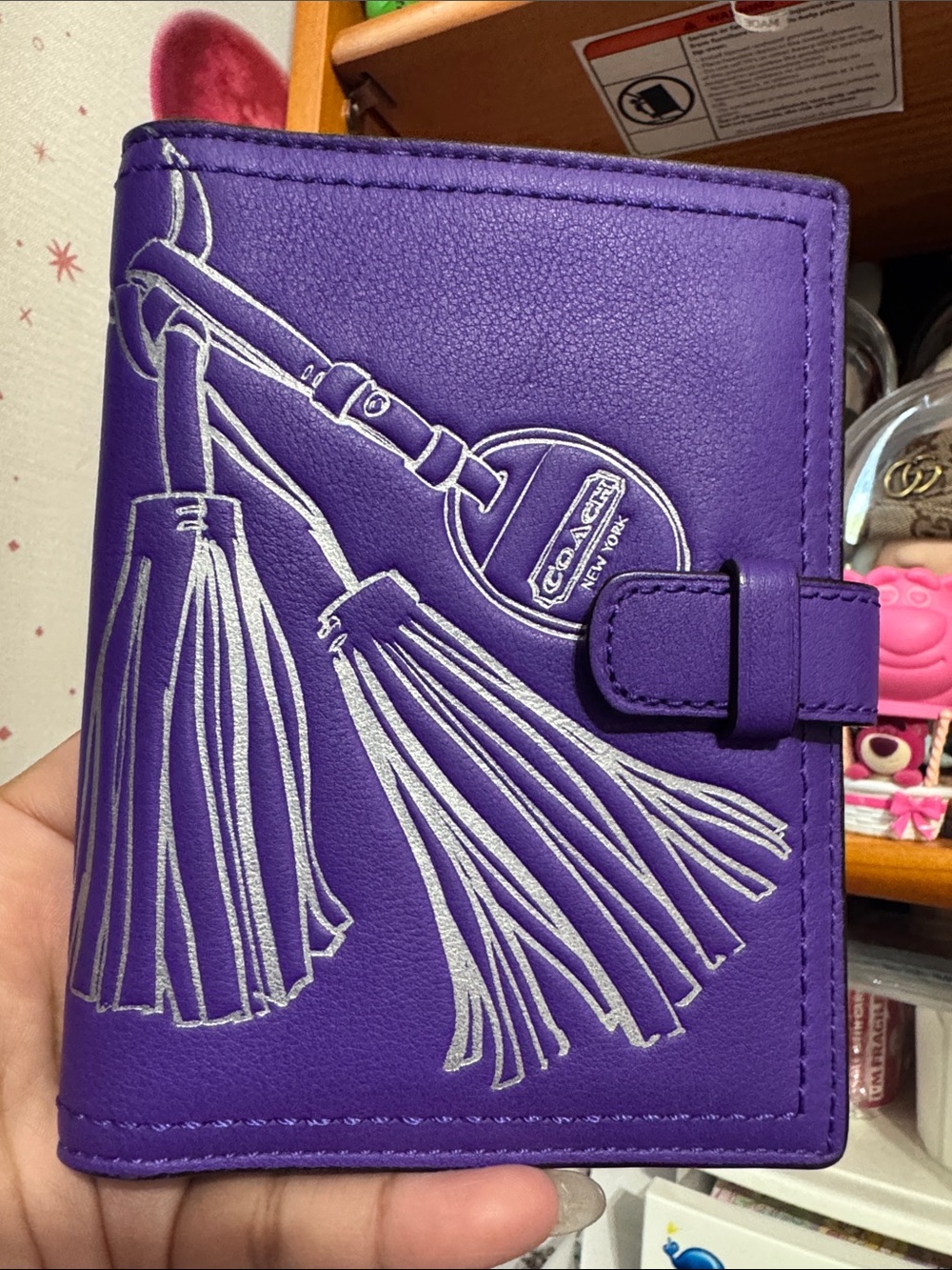 Coach passport holder with Tassel Motif